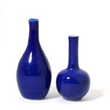 A Chinese Blue Ground Bottle Vase, Qing Dynasty, with tall slender neck, 11cm high; and A Similar