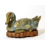A Chinese Turquoise Glaze Model of a Duck, in Song style, naturalistically modelled recumbent,