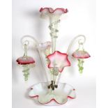 A Pink Vaseline Glass Epergne, with frilled rims, the central trumpet vase flanked by two further