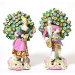 A Pair of Chelsea Style Porcelain Figures, circa 1900, as 18th century musicians standing before