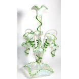 A Green Vaseline Glass Epergne, with frilled rims, the central trumpet vase flanked by three smaller