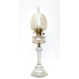 A Glass Oil Lamp, late 19th century, with etched shade, panelled reservoir, stem and stepped foot,