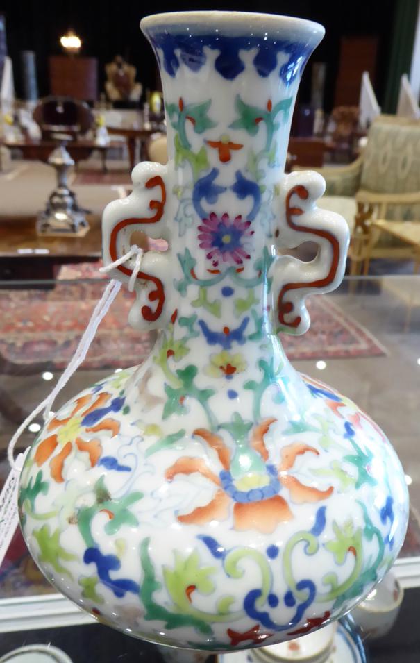 A Chinese Porcelain Bottle Vase, painted in Doucai with scrolling lotus, bears six character - Image 9 of 11