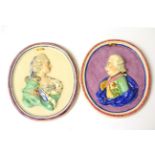 A Pair of Staffordshire Portrait Medallions, early 19th century, moulded and painted with bust