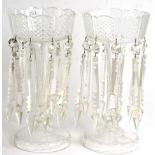 A Pair of Clear Glass Lustres, late 19th century, the diamond cut crenelated bowls hung with