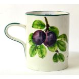 A Wemyss Pottery Cylindrical Mug, early 20th century, painted with fruiting plum branches, impressed