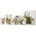 A Herend Porcelain Tea and Coffee Service, 20th century, painted with fruit and flowers within ozier