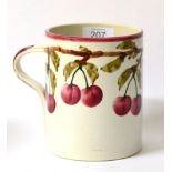 A Wemyss Pottery Cylindrical Mug, early 20th century, painted with fruiting cherry branches,