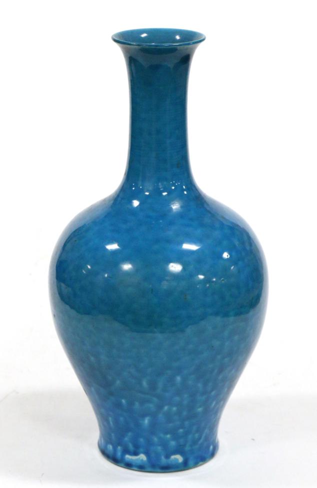 A Chinese Turquoise Ground Bottle Vase, 19th century, of baluster form with slender trumpet neck,