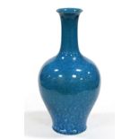 A Chinese Turquoise Ground Bottle Vase, 19th century, of baluster form with slender trumpet neck,