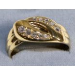 An 18 Carat Gold Diamond Snake Ring, as two coiled snakes with old cut diamond set heads, total