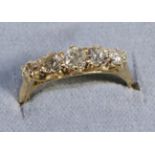 An 18 Carat Gold Diamond Five Stone Ring, graduated old cut diamonds in claw settings, total