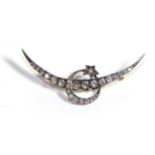 A Diamond Crescent and Star Brooch, intersecting crescents with a star, set throughout with old