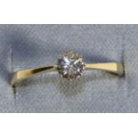 An 18 Carat Gold Solitaire Diamond Ring, a round brilliant cut diamond in a claw setting, to knife