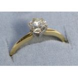 An 18 Carat Gold Solitaire Diamond Ring, a round brilliant cut diamond in a claw setting, to knife