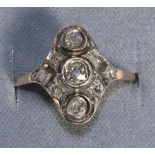 A Diamond Plaque Ring, three graduated old cut diamonds in milgrain settings, to a pierced diamond