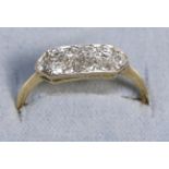 A Diamond Plaque Ring, grain set old cut diamonds to a canted plaque, to knife edge shoulders, total