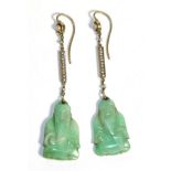 Pair of Figural Jade Earrings, a seed pearl within a circular frame suspends a seed pearl set bar