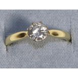 An 18 Carat Gold Solitaire Diamond Ring, a round brilliant cut diamond in a claw setting, to knife