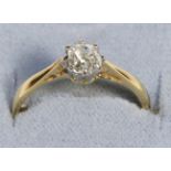 A Solitaire Diamond Ring, an old cushion cut diamond in a claw setting, to knife edge shoulders,