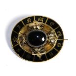 A Victorian Banded Agate and Black Enamel Mourning Brooch, an oval cabochon black agate in a