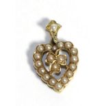 A Seed Pearl Heart Pendant, a central clover motif within a heart frame, to a seed pearl set bail,