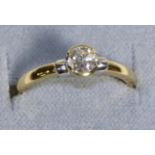 An 18 Carat Gold Solitaire Diamond Ring, a round brilliant cut diamond in a half rubbed over