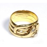 An 18 Carat Gold Diamond Snake Ring, a coiled snake as three bands with old cut diamond set eyes and