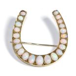 An Opal Horseshoe Brooch, set with graduated oval cabochon opals, in claw settings, measures 4.3cm