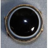 A Victorian Banded Agate Ring, a round banded agate in a rubbed over setting, to forked shoulders,