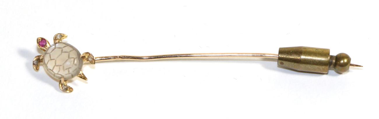 A Moonstone, Ruby and Diamond Sea Turtle Stick Pin, with a carved moonstone shell, a ruby set head