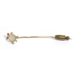 A Moonstone, Ruby and Diamond Sea Turtle Stick Pin, with a carved moonstone shell, a ruby set head