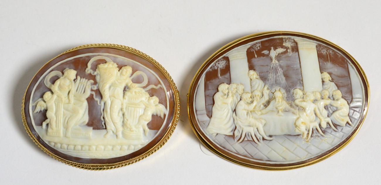 A Carved Shell Cameo Brooch, depicting the Last Supper, measures 5.5cm by 7cm and a Second Carved