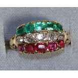 An Emerald, Diamond and Ruby Ring, as three gem set bands, to carved scroll shoulders, total