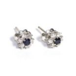 A Pair of Sapphire and Diamond Cluster Earrings, a round cut sapphire within a border of six round