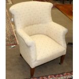 A Victorian Tub Shaped Armchair, mid 19th century, recovered in cream striped fabric with rounded