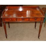 A Victorian Mahogany Writing Table, mid 19th century, with three-quarter gallery and reeded edge