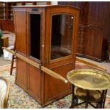 A Victorian Sedan Chair, late 19th century, with oak carrying arms, the glazed door enclosing a