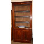 A Victorian Mahogany Bookcase, circa 1850, of breakfront form with four shelves above two cupboard