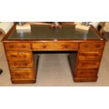 A Victorian Mahogany Double Pedestal Writing Desk, 3rd quarter 19th century, with inset green