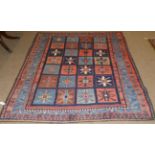 Bakhtiari Rug West Iran, circa 1940 The polychrome compartmentalised field enclosed by mid indigo