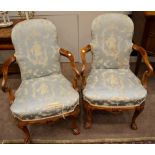 A Pair of Walnut Armchairs, early 20th century, in George I style, covered in worn blue