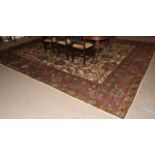 Indian Carpet, circa 1920 The pale camel field with an allover design of large flowerheads,