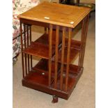 An Edwardian Mahogany and Satinwood Banded Revolving Bookcase, early 20th century, with slatted