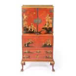 A Red Japanned and Parcel Gilt Secretaire Cabinet, circa 1920/30, with pagoda cornice above cupboard