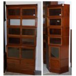 An Edwardian Mahogany and Satinwood Banded Six Piece Sectional Bookcase, the upper section with