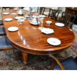 A Victorian Mahogany Extending Dining Table, circa 1870, of rounded rectangular form with four