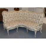 A 19th Century White Painted and Parcel Gilt Corner Sofa, in Louis XV style, recovered in cream,