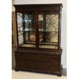 A Victorian Carved Mahogany Display Cabinet, late 19th century, the upper section with blind fret