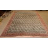 Ghom Carpet Central Iran, circa 1960 The ivory field of boteh enclosed by brick red borders of